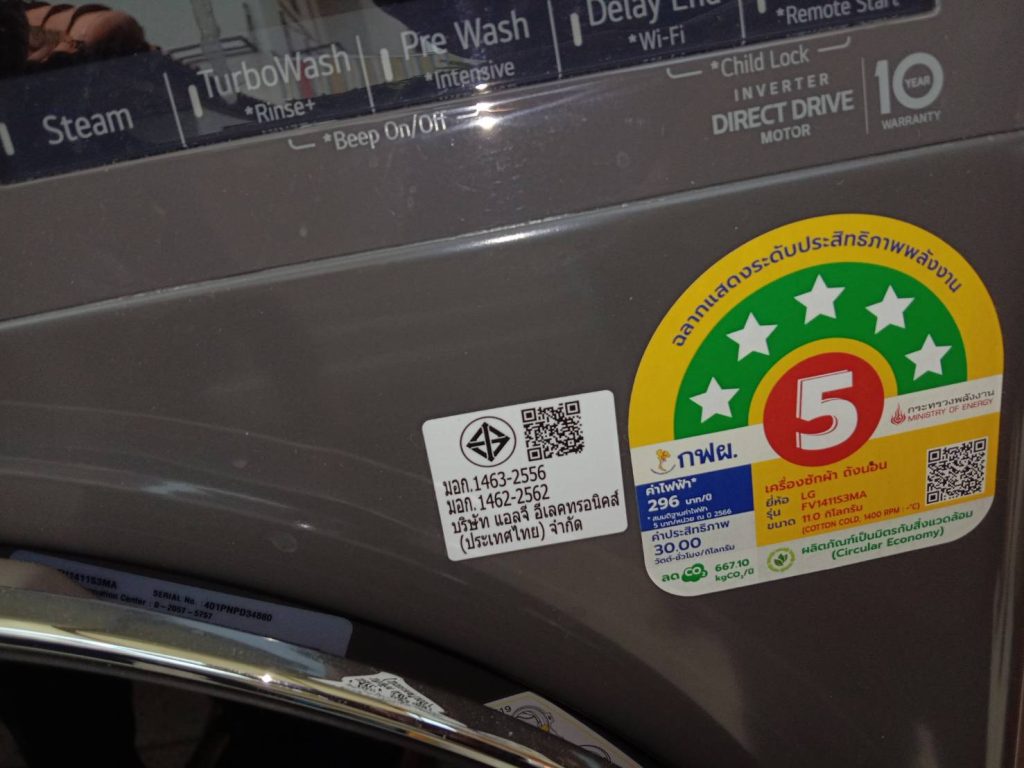 washing machine with energy and safety labels from Thailand.