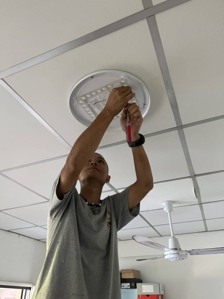 repairing a ceiling LED light.