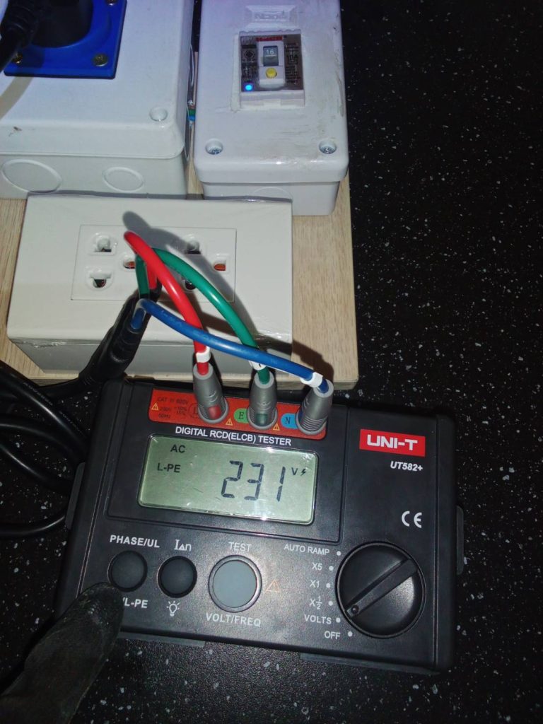 test setup for checking AC voltage and safety using a digital RCD/ELCB tester