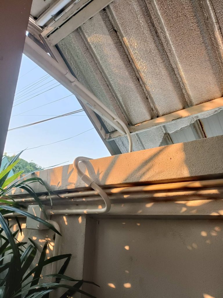 An electrical conduit runs along the wall and roof.