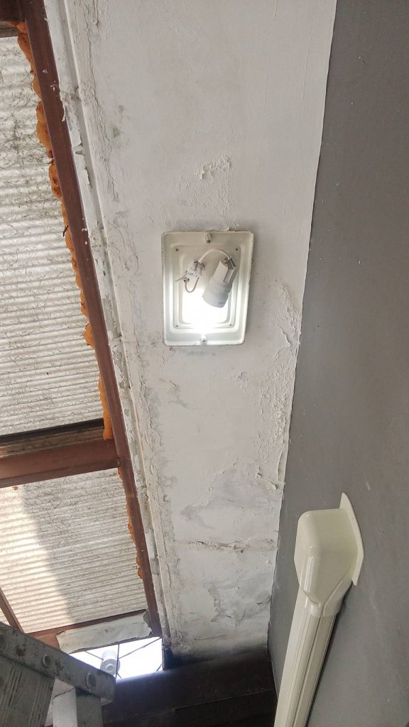 A ceiling light fixture with an LED bulb installed