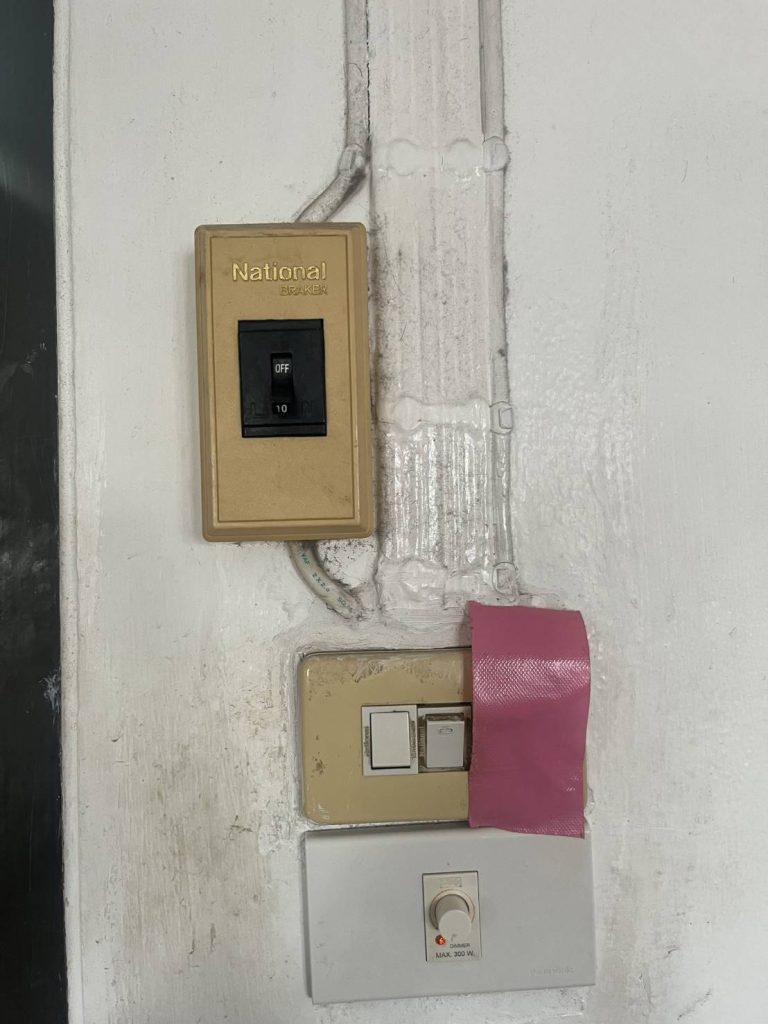 A small wall panel with three devices