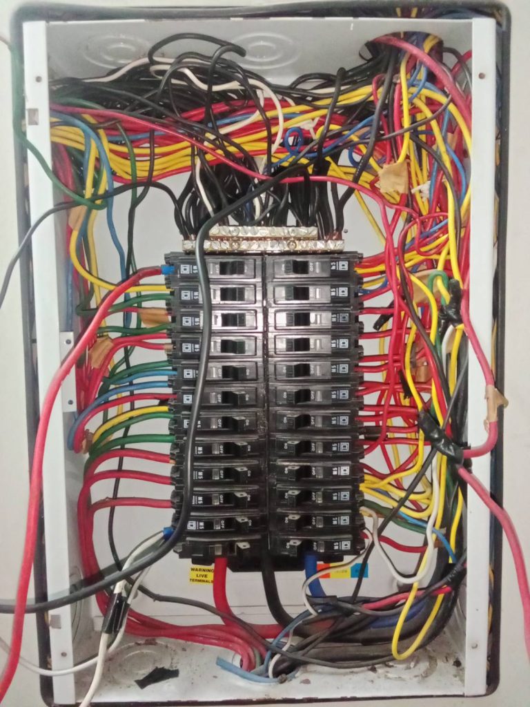 A messy electrical panel.