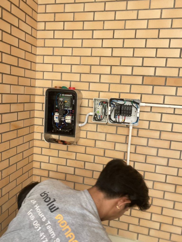 electrician is installing an EV charger
